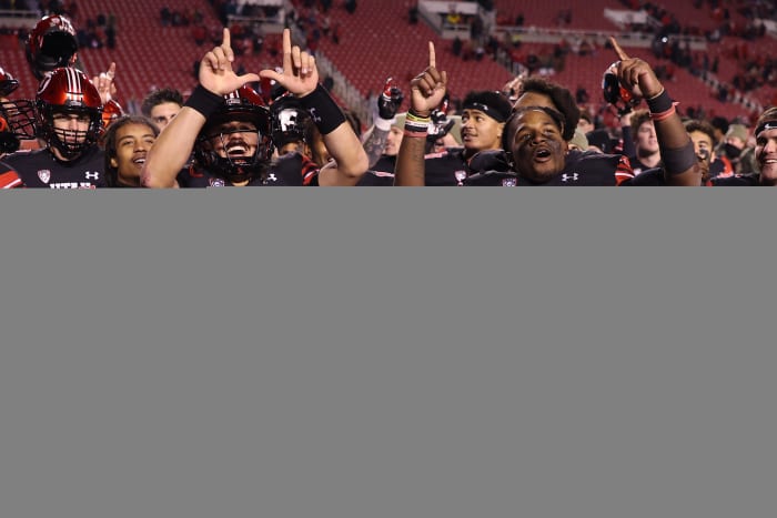 Utah Utes quarterback Cameron Rising (7) and running back Tavion Thomas (9) react to a win against the Stanford Cardinal at Rice-Eccles Stadium.